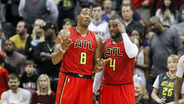 Jan 1, 2017; Atlanta, GA, USA; Atlanta Hawks center Dwight Howard (8) talks to forward Paul Millsap (4) against the San Antonio Spurs in overtime at Philips Arena. The Hawks won 114-112 in overtime. Mandatory Credit: Brett Davis-USA TODAY Sports
