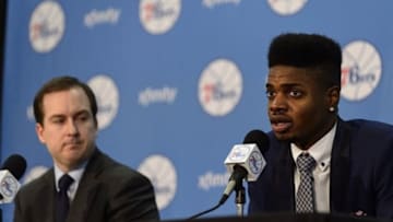 Jul 23, 2013; Philadelphia, PA, USA; First round draft pick center Nerlens Noel addresses the media as 76ers general manager Sam Hinkie listens during a press conference at PCOM. Mandatory Credit: Howard Smith-USA TODAY Sports
