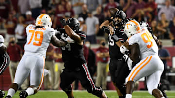 COLUMBIA, SOUTH CAROLINA - SEPTEMBER 26: Quarterback Collin Hill #15 of the South Carolina Gamecocks attempts a pass as defensive linemen Matthew Butler #94 and Kurott Garland #79 of the Tennessee Volunteers pressure him during the football game at Williams-Brice Stadium on September 26, 2020 in Columbia, South Carolina. (Photo by Mike Comer/Getty Images)