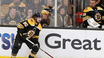 BOSTON, MA - MAY 12: Boston Bruins left wing Marcus Johansson (90) holds the puck along the boards during Game 2 of the Stanley Cup Playoffs Eastern Conference Finals between the Boston Bruins and the Carolina Hurricanes on May 12, 2019, at TD Garden in Boston, Massachusetts. (Photo by Fred Kfoury III/Icon Sportswire via Getty Images)