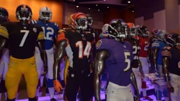 Jan 25, 2015; Phoenix, AZ, USA; General view of mannequins with the uniform and helmets of NFL teams at the Super Bowl shop at the NFL Experience at Phoenix Convention Center in advance of Super Bowl XLIX between the Seattle Seahawks and the New England Patriots. Mandatory Credit: Kirby Lee-USA TODAY Sports