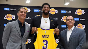 EL SEGUNDO, CALIFORNIA - JULY 13: Anthony Davis (C) is introduced as the newest player of the Los Angeles Lakers during a press conference with general manager Rob Pelinka and head coach Frank Vogel (R) at UCLA Health Training Center on July 13, 2019 in El Segundo, California. NOTE TO USER: User expressly acknowledges and agrees that, by downloading and/or using this Photograph, user is consenting to the terms and conditions of the Getty Images License Agreement. (Photo by Kevork Djansezian/Getty Images)