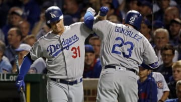 Oct 16, 2016; Chicago, IL, USA; Los Angeles Dodgers first baseman Adrian Gonzalez (23) celebrates with center fielder Joc Pederson (31) after hitting a solo home run during the second inning in game two of the 2016 NLCS playoff baseball series at Wrigley Field. Mandatory Credit: Jon Durr-USA TODAY Sports