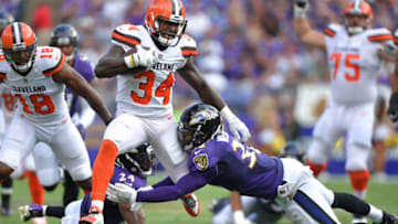 The Baltimore Ravens' Eric Weddle (32) makes a tackle on Cleveland Browns running back Isaiah Crowell (34) on September 17, 2017 at M