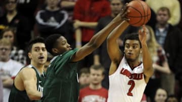 Nov 26, 2014; Louisville, KY, USA; Louisville Cardinals guard Quentin Snider (2) tries to pass the ball under the pressure of Cleveland State Vikings guard Kenny Carpenter (4) during the first half at KFC Yum! Center. Mandatory Credit: Jamie Rhodes-USA TODAY Sports
