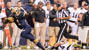 Sep 13, 2014; Indianapolis, IN, USA; Notre Dame Fighting Irish running back Greg Bryant (1) runs the ball as Purdue Boilermakers safety Landon Feichter (44) defends in the third quarter at Lucas Oil Stadium. Notre Dame won 30-14. Mandatory Credit: Matt Cashore-USA TODAY Sports
