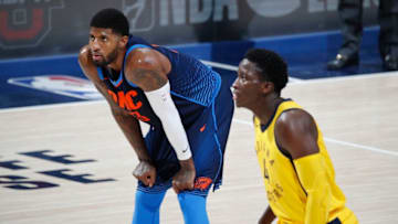 INDIANAPOLIS, IN - DECEMBER 13: Paul George #13 of the Oklahoma City Thunder looks on alongside Victor Oladipo #4 of the Indiana Pacers during a game at Bankers Life Fieldhouse on December 13, 2017 in Indianapolis, Indiana. The Thunder defeated the Pacers 100-95. NOTE TO USER: User expressly acknowledges and agrees that, by downloading and or using the photograph, User is consenting to the terms and conditions of the Getty Images License Agreement. (Photo by Joe Robbins/Getty Images)