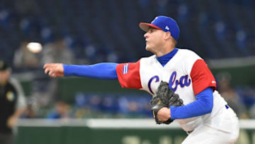 Starting pitcher Lazaro Blanco of Cuba throws in the top of the first inning during the World Baseball Classic Pool E second round match between Cuba and the Netherlands at Tokyo Dome in Tokyo on March 15, 2017. / AFP PHOTO / Kazuhiro NOGI (Photo credit should read KAZUHIRO NOGI/AFP via Getty Images)