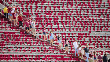 FAYETTEVILLE, AR - AUGUST 31: Student Section of the Arkansas Razorbacks file into the stands before a game against the Portland State Vikings at Razorback Stadium on August 31, 2019 in Fayetteville, Arkansas. (Photo by Wesley Hitt/Getty Images)