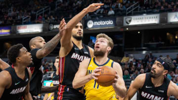 Indiana Pacers forward Domantas Sabonis (11) looks to shoot the ball while Miami Heat center Omer Yurtseven (77) defends(Trevor Ruszkowski-USA TODAY Sports)