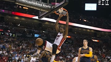 Mar 16, 2015; Miami, FL, USA; Miami Heat center Hassan Whiteside (21) dunks during the third quarter against the Cleveland Cavaliers at American Airlines Arena. Miami Heat defeated against the Cleveland Cavaliers 106-92. Mandatory Credit: Tommy Gilligan-USA TODAY Sports