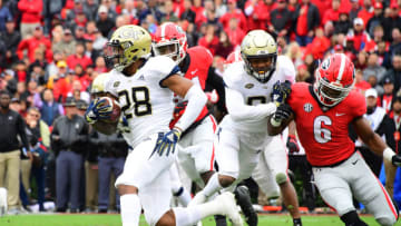 ATHENS, GA - NOVEMBER 24: Juanyeh Thomas #28 of the Georgia Tech Yellow Jackets runs back a kickoff for a 100 yard touchdown in the first quarter against the Georgia Bulldogs on November 24, 2018 at Sanford Stadium in Athens, Georgia. (Photo by Scott Cunningham/Getty Images)