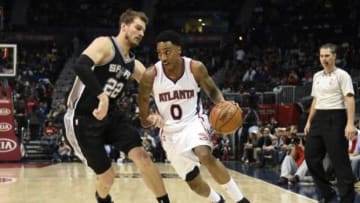 Mar 22, 2015; Atlanta, GA, USA; Atlanta Hawks guard Jeff Teague (0) dribbles against San Antonio Spurs center Tiago Splitter (22) during the first half at Philips Arena. Mandatory Credit: Dale Zanine-USA TODAY Sports