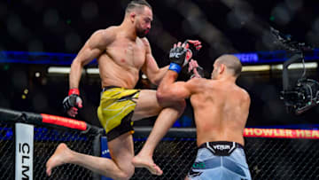 Jan 22, 2022; Anaheim, California, USA; Michel Pereira (red gloves) competes against Andre Fialho (blue gloves) during UFC 270 at Honda Center. Mandatory Credit: Gary A. Vasquez-USA TODAY Sports
