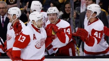 Apr 18, 2014; Boston, MA, USA; Detroit Red Wings center Pavel Datsyuk (13) celebrates with teammates after scoring a goal during the third period against the Boston Bruins in game one of the first round of the 2014 Stanley Cup Playoffs at TD Banknorth Garden. The Red Wings won 1-0. Mandatory Credit: Greg M. Cooper-USA TODAY Sports