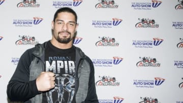 WASHINGTON, DC - JANUARY 28: WWE Wrestler Roman Reigns signs autographs during the Washington Auto Show at the Washington Convention Center in Washington DC on January 28, 2016. (Kris Connor/Getty Images)