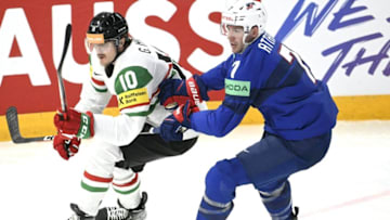 Hungary's forward Gergo Nagy and USA's defender Ronnie Attard vie during the IIHF Ice Hockey Men's World Championships Preliminary Round - Group A match between USA and Hungary in Tampere, Finland, on May 14, 2023. (Photo by Heikki Saukkomaa / Lehtikuva / AFP) / Finland OUT (Photo by HEIKKI SAUKKOMAA/Lehtikuva/AFP via Getty Images)