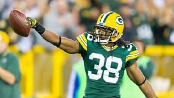 Sep 13, 2012; Green Bay, WI, USA; Green Bay Packers cornerback Tramon Williams (38) celebrates an interception during the game against the Chicago Bears at Lambeau Field. The Packers defeated the Bears 23-10. Mandatory Credit: Jeff Hanisch-USA TODAY Sports