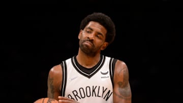 Mar 8, 2022; Charlotte, North Carolina, USA; Brooklyn Nets guard Kyrie Irving (11) reacts after scoring during the second half against the Charlotte Hornets at the Spectrum Center. Mandatory Credit: Sam Sharpe-USA TODAY Sports