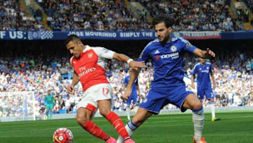 LONDON, ENGLAND - SEPTEMBER 19: Alexis Sanchez of Arsenal is challenged by Cesc Fabregas of Chelsea during the Barclays Premier League match between Chelsea and Arsenal on September 19, 2015 in London, United Kingdom. (Photo by David Price/Arsenal FC via Getty Images)