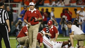 Dec 31, 2015; Miami Gardens, FL, USA; Oklahoma Sooners head coach Bob Stoops walks back to the sidelines after checking on running back Samaje Perine (32) against the Clemson Tigers in the third quarter of the 2015 CFP Semifinal at the Orange Bowl at Sun Life Stadium. Mandatory Credit: Kim Klement-USA TODAY Sports