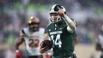 EAST LANSING, MI - NOVEMBER 18: Brian Lewerke #14 of the Michigan State Spartans runs for a first half touchdown in front of Isaiah Davis #22 of the Maryland Terrapins at Spartan Stadium on November 18, 2017 in East Lansing, Michigan. (Photo by Gregory Shamus/Getty Images)