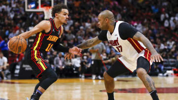 Atlanta Hawks guard Trae Young (11) dribbles the basketball as Miami Heat forward P.J. Tucker (17) defends(Sam Navarro-USA TODAY Sports)