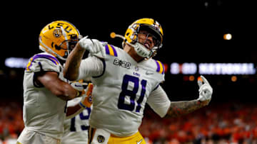 NEW ORLEANS, LOUISIANA - JANUARY 13: Thaddeus Moss #81 of the LSU Tigers celebrates after scoring a touchdown against the Clemson Tigers during the third quarter in the College Football Playoff National Championship game at Mercedes Benz Superdome on January 13, 2020 in New Orleans, Louisiana. (Photo by Jonathan Bachman/Getty Images)