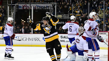 PITTSBURGH, PA - DECEMBER 31: Sidney Crosby #87 of the Pittsburgh Penguins celebrates an overtime goal scored by Evgeni Malkin #71 against the Montreal Canadiens at PPG PAINTS Arena on December 31, 2016 in Pittsburgh, Pennsylvania. (Photo by Matt Kincaid/Getty Images)