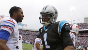 Sep 15, 2013; Orchard Park, NY, USA; Buffalo Bills quarterback EJ Manuel (3) and Carolina Panthers quarterback Cam Newton (1) shake hands after a game at Ralph Wilson Stadium. Buffalo beats Carolina 27 to 26. Mandatory Credit: Timothy T. Ludwig-USA TODAY Sports