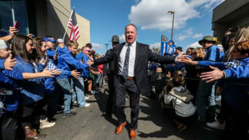 UK head football coach Mark Stoops greets the fans at Cat Walk