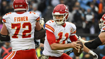 Nov 13, 2016; Charlotte, NC, USA; Kansas City Chiefs quarterback Alex Smith (11) with the ball as tackle Eric Fisher (72) blocks in the fourth quarter. The Chiefs defeated the Panthers 20-17 at Bank of America Stadium. Mandatory Credit: Bob Donnan-USA TODAY Sports