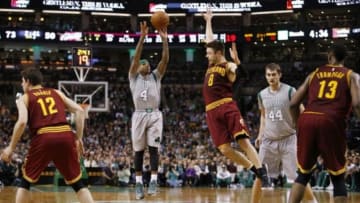 Apr 12, 2015; Boston, MA, USA; Boston Celtics guard Isaiah Thomas (4) shoots against Cleveland Cavaliers guard Matthew Dellavedova (8) in the second half at TD Garden. The Celtics defeated the Cleveland Cavaliers 117-78. Mandatory Credit: David Butler II-USA TODAY Sports