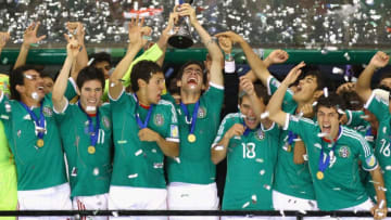 MEXICO CITY, MEXICO - JULY 10: Antonio Briseno of Mexico lifts the trophy after beating Uruguay 2-0 in the FIFA U-17 World Cup Mexico 2011 Final at the Azteca Stadium on July 10, 2011 in Mexico City, Mexico. (Photo by Jeff Mitchell - FIFA/FIFA via Getty Images)