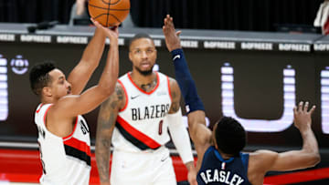CJ McCollum of the Portland Trail Blazers shoots over Malik Beasley of the Minnesota Timberwolves. (Photo by Steph Chambers/Getty Images)