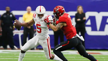 HOUSTON, TX - SEPTEMBER 01: DaMarkus Lodge #5 of the Mississippi Rebels is tackled by Desmon Smith #4 of the Texas Tech Red Raiders in the first half at NRG Stadium on September 1, 2018 in Houston, Texas. (Photo by Bob Levey/Getty Images)