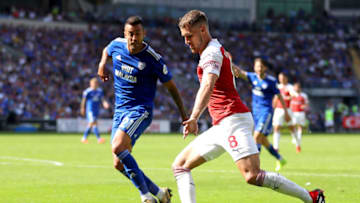 CARDIFF, WALES - SEPTEMBER 02: Aaron Ramsey of Arsenal is watched by Victor Camarasa of Cardiff City during the Premier League match between Cardiff City and Arsenal FC at Cardiff City Stadium on September 2, 2018 in Cardiff, United Kingdom. (Photo by Catherine Ivill/Getty Images)