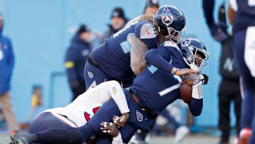 NASHVILLE, TENNESSEE - DECEMBER 24: Malik Willis #7 of the Tennessee Titans is tackled by Maliek Collins #96 of the Houston Texans during the second half at Nissan Stadium on December 24, 2022 in Nashville, Tennessee. (Photo by Wesley Hitt/Getty Images)