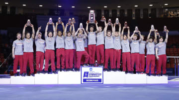 Apr 16, 2022; Norman, OK, USA; The Oklahoma Sooners gymnastic team celebrates with the NCAA second place trophy in the 2022 NCAA menÕs gymnastics championship at University of Oklahoma. Mandatory Credit: Alonzo Adams-USA TODAY Sports