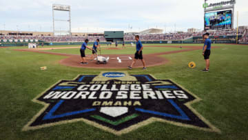 OMAHA, NEBRASKA - JUNE 30: Members of the ground ready the field before the start of the Vanderbilt Commodores and Mississippi St. Bulldogs game three of the College World Series Championship at TD Ameritrade Park Omaha on June 30, 2021 in Omaha, Nebraska. (Photo by Sean M. Haffey/Getty Images)