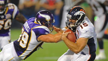 MINNEAPOLIS - SEPTEMBER 02: Tim Tebow #15 of the Denver Broncos carries the ball and is tackled by Heath Farwell #59 of the Minnesota Vikings during an NFL preseason game at the Mall of America Field at Hubert H. Humphrey Metrodome, on September 2, 2010 in Minneapolis, Minnesota. (Photo by Tom Dahlin/Getty Images)
