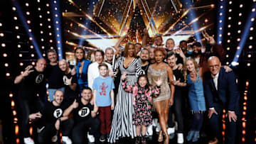 AMERICA'S GOT TALENT -- "Live Results 2" -- Pictured: (l-r) Light Balance, Heidi Klum, Mandy Harvey, Merrick Hanna, Tyra Banks, Celine Tam, Mel B, Johnny Manuel, Evie Clair, Eric Jones, Howie Mandel -- (Photo by: Trae Patton/NBC)
