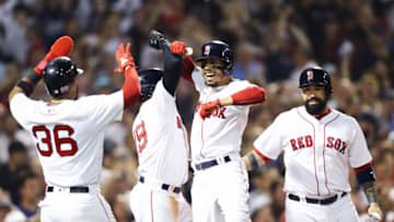 BOSTON, MA - JULY 12: Mookie Betts #50 of the Boston Red Sox celebrates with Eduardo Nunez #36, Jackie Bradley Jr. #19 and Sandy Leon #3 after hitting a grand slam against the Toronto Blue Jays during the fourth inning at Fenway Park on July 12, 2018 in Boston, Massachusetts. (Photo by Maddie Meyer/Getty Images)