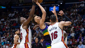 New Orleans Pelicans guard Dyson Daniels (11) shoots a jump shot against Miami Heat center Bam Adebayo (13) and forward Caleb Martin (16)( Stephen Lew-USA TODAY Sports)