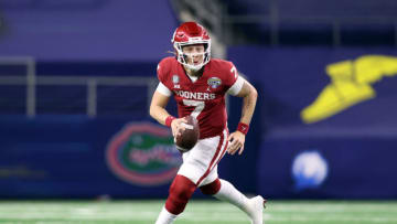 Dec 30, 2020; Arlington, TX, USA; Oklahoma Sooners quarterback Spencer Rattler (7) rolls out during the fourth quarter against the Florida Gators at ATT Stadium. Mandatory Credit: Tim Heitman-USA TODAY Sports