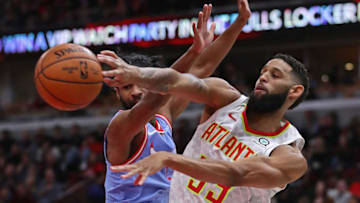 CHICAGO, ILLINOIS - DECEMBER 28: Allen Crabbe #33 of the Atlanta Hawks passes around Coby White #0 of the Chicago Bulls at the United Center on December 28, 2019 in Chicago, Illinois. NOTE TO USER: User expressly acknowledges and agrees that , by downloading and or using this photograph, User is consenting to the terms and conditions of the Getty Images License Agreement. (Photo by Jonathan Daniel/Getty Images)
