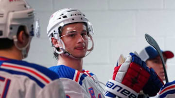 Feb 21, 2020; Raleigh, North Carolina, USA; New York Rangers right wing Julien Gauthier (12) waits outside the locker room against the Carolina Hurricanes at PNC Arena. The New York Rangers defeated the Carolina Hurricanes 5-2. Mandatory Credit: James Guillory-USA TODAY Sports