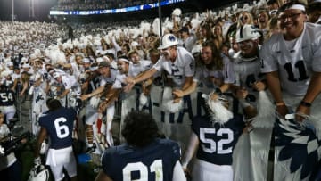 Sep 18, 2021; University Park, Pennsylvania, USA; Penn State Nittany Lion players celebrate with members of the Penn State student section following the competition of the game against the Auburn Tigers at Beaver Stadium. Penn State defeated Auburn 28-20. Mandatory Credit: Matthew OHaren-USA TODAY Sports