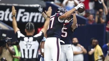 Oct 2, 2016; Houston, TX, USA; Houston Texans tight end C.J. Fiedorowicz (87) celebrates with wide receiver Will Fuller (15) after scoring a touchdown during the first quarter against the Tennessee Titans at NRG Stadium. Mandatory Credit: Troy Taormina-USA TODAY Sports