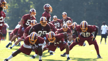 ASHBURN, VA - JULY 29: Washington Redskins players stretch during the first day of training camp at Redskins Park on July 29, 2011 in Ashburn, Virginia. (Photo by Mitchell Layton/Getty Images)